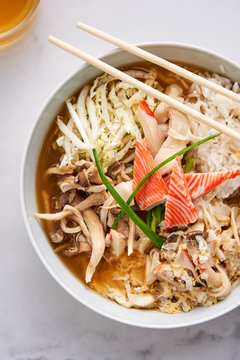 Asian-style bowl with mushrooms, rice and surimi