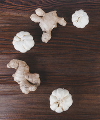 ginger and garlic on wooden background
