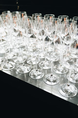 many clean wineglasses in bar, professional equipment 