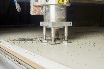 CNC tablet machine. Cutting aluminum composite panels.