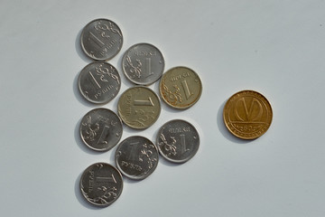 Round coins. Cutting of money with a knife