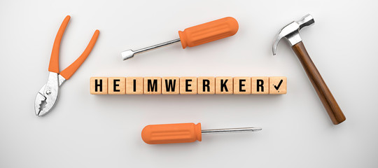 set of tools and cubes with German message for HOME HANDYMAN on white background