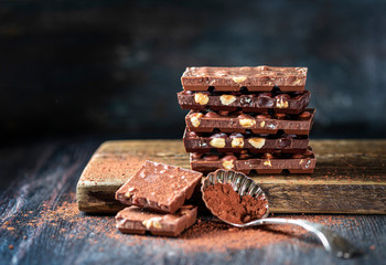 Dark chocolate over wooden background