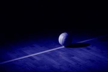Volleyball court wooden floor with ball on black with copy-space. Phantom color trend 2020. Banner Art concept
