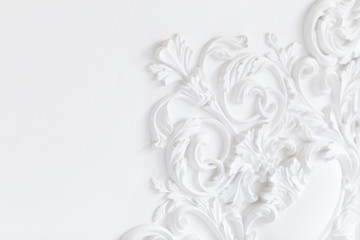 Beautiful ornate white decorative plaster moldings in studio.