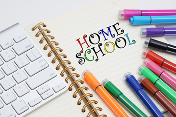 Colored marker pen, book, keyboard and mouse. concepts of home schooling and online schooling.