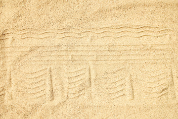 A Drawing in the sand near the sea in nature travel background. Hand drawn on vacation.
