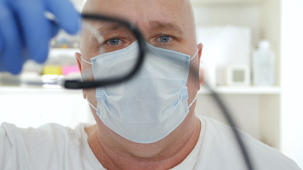 Doctor Wearing Protective Face Mask, Medical Person with Protection Equipment in a Quarantined Hospital Against Coronavirus Epidemic