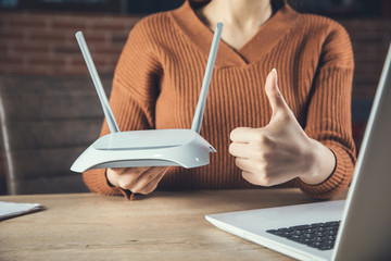 woman and Wifi router