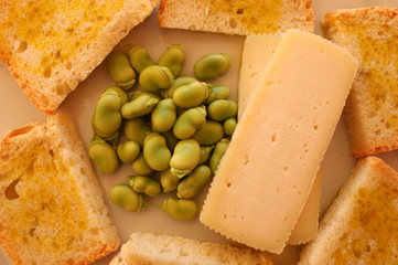 homemade bread with  extra virgin olive oil, fava beans and cheese