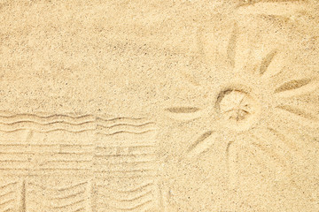 A Drawing in the sand near the sea in nature travel background. Hand drawn on vacation.