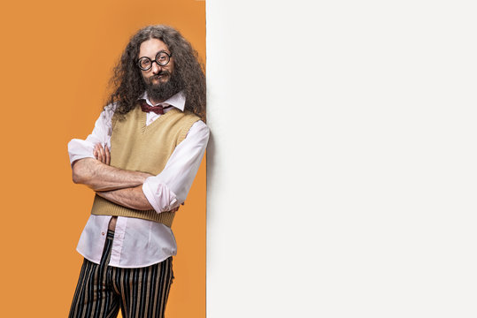 Portrait Of An Eccentric Man Posing Next To The White Board