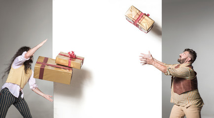 Funny guys juggling with the presents