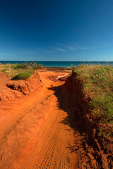 Western Australia – Outback sand track for 4WD car downhill to the ocean at Dampier Peninsula