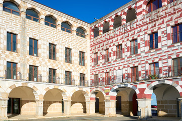 Plaza Alta red, yellow and white buildings in Badajoz, Spain