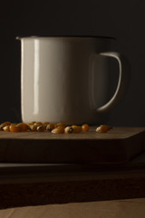Corn kernels on a wooden table with a white metal