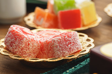 Close up of a little oriental plate with turkish delights sweets