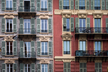 Nice, France - April 2017: Colours and styles of Nice classic apartment buidlings