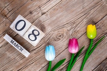 March 8, wooden calendar and tulips, women's day