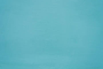 Blue background of the texture wall. Painted plaster close-up.