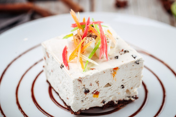 Marmalade cheesecake on a decorated plate, horizontal