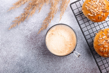 Coffee and fresh homemade buns. Breakfast with coffee and pastries. Scandinavian style. Minimalism. Top view