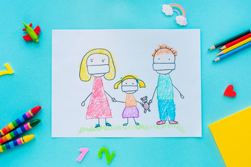 Kids hand drawing picture of family in face masks on blue background