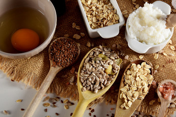 raw egg, shea butter, linseed, oatmeal, salt, sunflower seeds for the production of homemade cosmetics