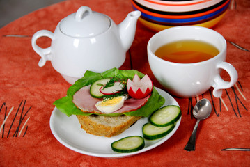 healthy breakfast sandwich with ham and vegetables and sweet tea