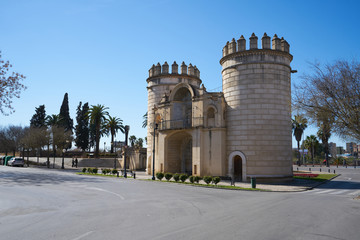 Puerta de Palmas entrance towers on a middle of a road in Badajoz, Spain