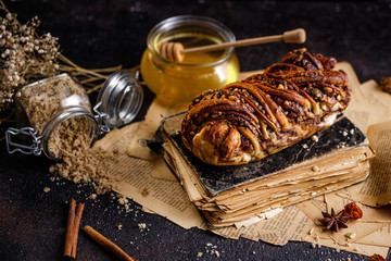 Swirl brioche or traditional Polish babka cake with walnut, apple and honey