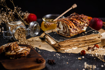 Swirl brioche or traditional Polish babka cake with walnut, apple and honey