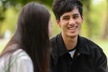 Fototapeta premium Happy young group of friends having fun together at the park