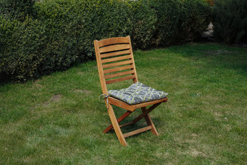 a chair in the garden. sunny day. weekends