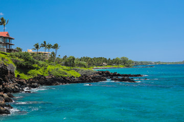 Coastal View in Wailea Maui Hawaii of Turquoise Pacific Ocean, Lush Greenery and Volcanic Rock