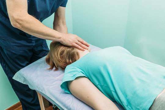 young woman getting professional neck treatment at physiotherapist