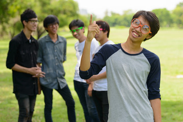 Happy young group of men as friends with eyeglasses together
