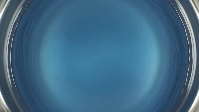 Rheoscopic fluid. Beautiful movement of color particles in a liquid. Fantastic patterns and shapes.