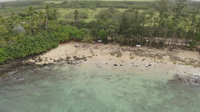Flying towards Laniakea Beach on the island of Oahu, Hawaii with overcast skies.