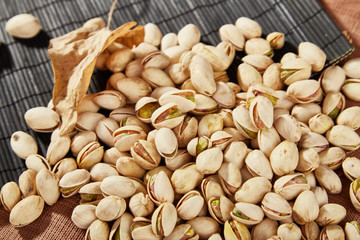 Charred cashew nuts in light containers