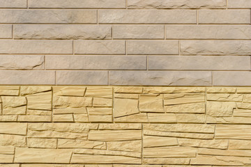 Cladding wall made of natural stone panels in pastel colors. Coverage for exterior design of building in closeup with your place for text