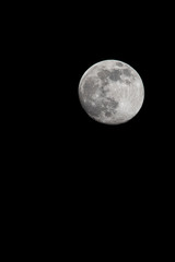 Almost full moon close up shot in a clear sky