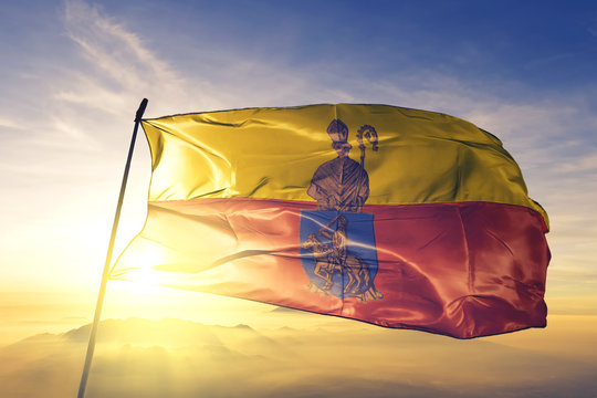 Herstal of Liege of Belgium flag waving on the top sunrise mist fog