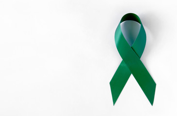 Green Cancer Awareness Symbolic Ribbon. Problem of organ donation, mental health. On a White background