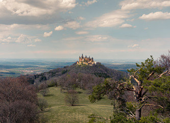 View of the German Hohenzollern Castle on a sunny spring day with some clouds