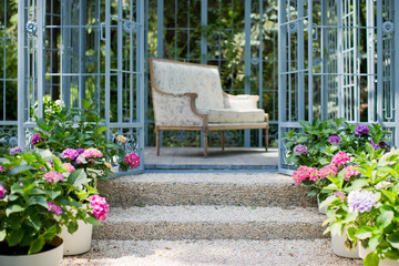 Vintage sofa in a metal gazebo