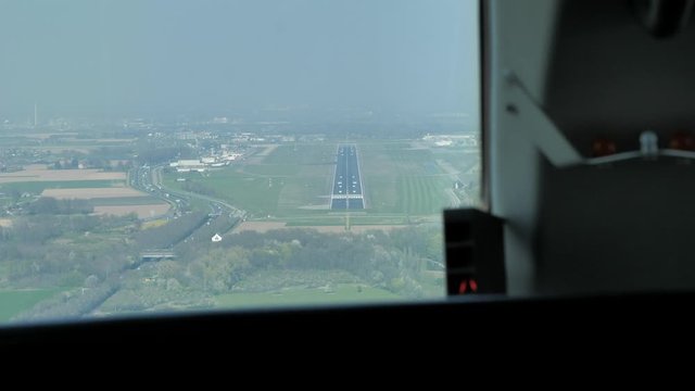 Pilot view from cockpit approaching the runway. First person point of view