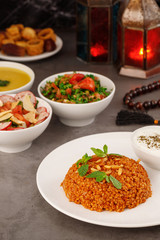 Ramadan. Arabic family dinner. Traditional arabic food. Close-up view. Eid Mubarak. Table with sharing plates food. Ramadan decoration. Lebanese cuisine. Starters, hummus, baklava, dates. Muslim