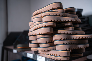 shelf with mold and insoles for shoe on modern factory