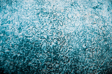 background of dark turquoise color. spots on the blue surface